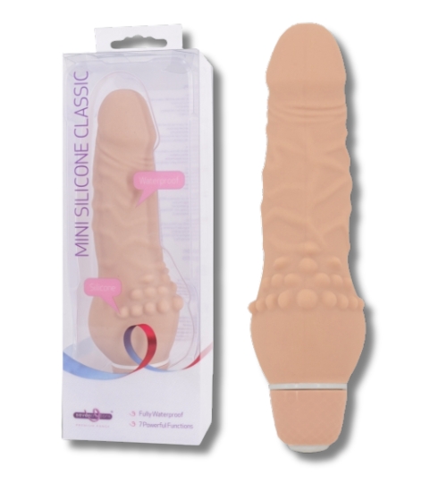 Malý vibrátor tělové barvy vyrobený ze silikonu